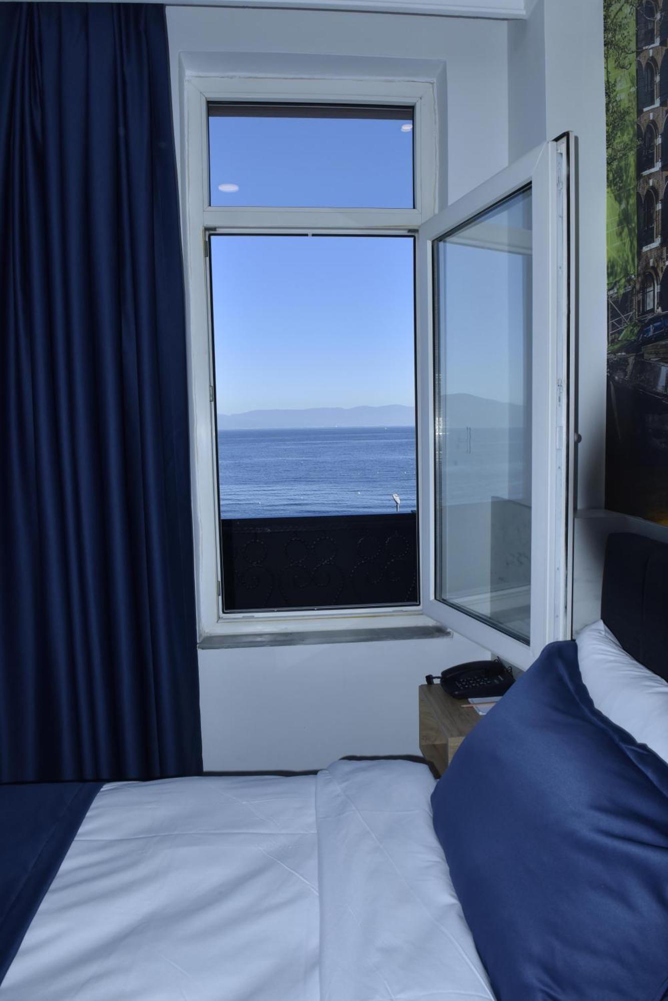 Bella Otel Мудания Екстериор снимка