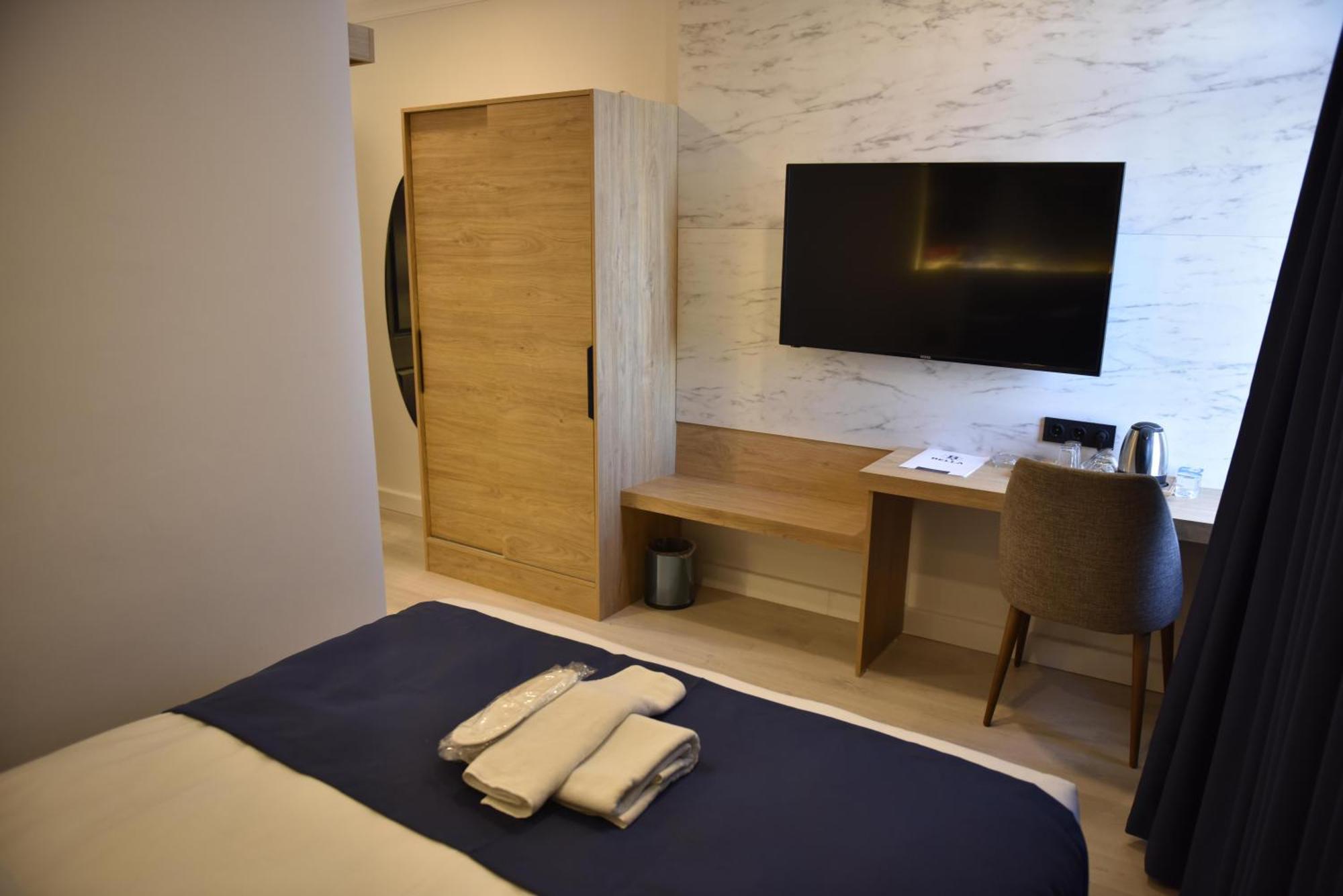 Bella Otel Мудания Екстериор снимка